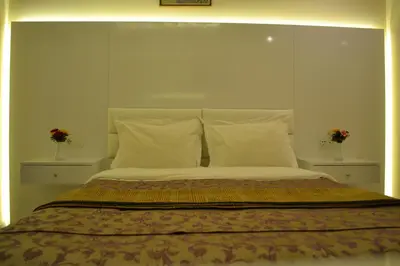 a bedroom with a large bed with two vases at Grand Fatih Hotel in Istanbul