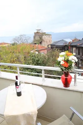 a balcony with a table and a vase of flowers at Aycan Sultan Apart Hotel in Istanbul