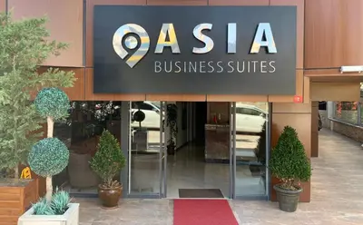 a store with a sign on the front of a building at Asia Business Suites in Istanbul