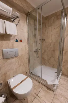 a bathroom with a shower and a toilet at Asia Business Suites in Istanbul