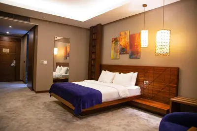 a bedroom with a large bed in a room at Gold Majesty Hotel in Bursa