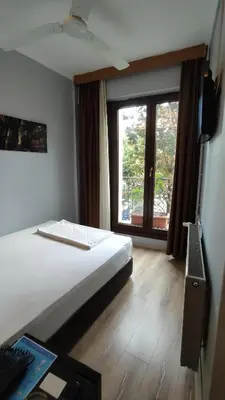 a hotel room with a bed and a window at Hotel Torun Istanbul Old City in Istanbul