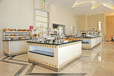 a restaurant with a buffet line with food at Crowne Plaza Bursa Convention Center & Thermal Spa by IHG in Bursa