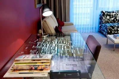 a glass table with books on it in a living room at 116 Residence in Istanbul