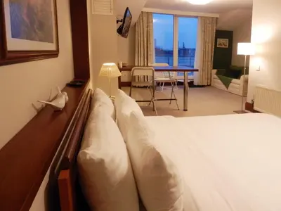 a hotel room with a bed and a table at 116 Residence in Istanbul