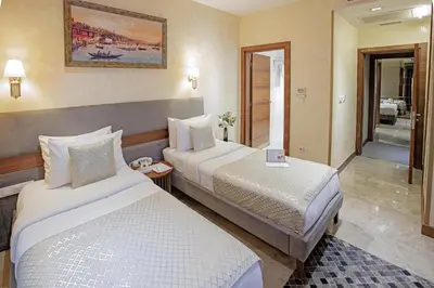 a hotel room with two beds and a bathroom at Nowy Efendi Hotel - Special Category in Istanbul