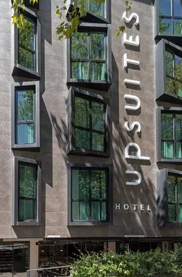 a hotel sign on the side of a building at Upsuites Hotel in Istanbul