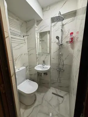 a bathroom with a toilet and a sink at Hotel Wiva in Istanbul