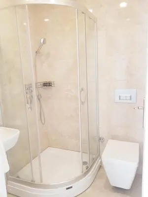 a bathroom with a shower with a toilet and a sink at Zeugma Hotel Sultanahmet in Istanbul