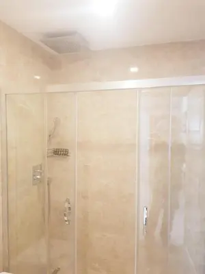 a shower with a glass door in a bathroom at Zeugma Hotel Sultanahmet in Istanbul