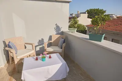 a patio with a table and chairs on a balcony at Albatros Hagia Sophia Hotel in Istanbul