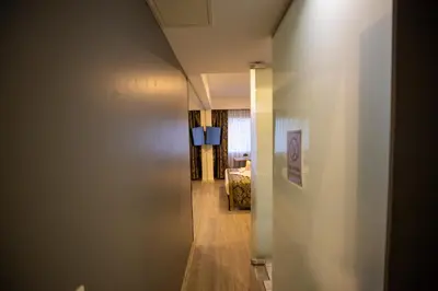 a hallway leading into a living room with a hallway at Albatros Hagia Sophia Hotel in Istanbul