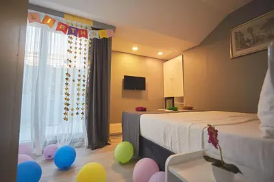 a room with two beds and balloons on the floor at Albatros Hagia Sophia Hotel in Istanbul