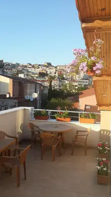 a patio with a table and chairs on a balcony at Hagia Sophia Apartment in Istanbul