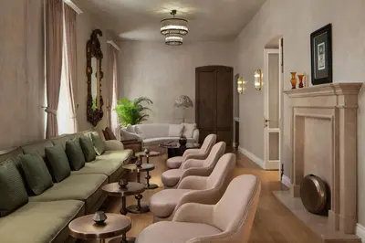 a living room with couches and chairs and tables at Adahan DeCamondo Pera, Autograph Collection in Istanbul