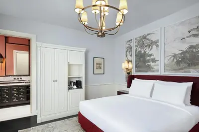 a bedroom with a white bed and a chandelier at Adahan DeCamondo Pera, Autograph Collection in Istanbul