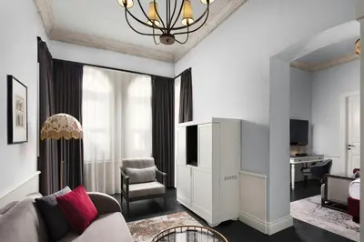 a living room with a couch and a chair at Adahan DeCamondo Pera, Autograph Collection in Istanbul