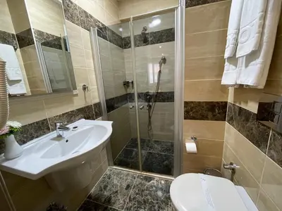 a bathroom with a sink and a shower at Gul Hotel in Istanbul