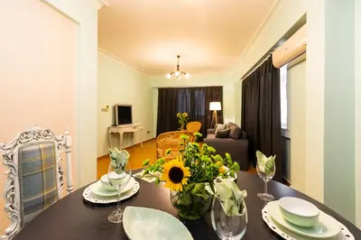 a living room with a table with flowers on it at Ajda Haus Nisantasi in Istanbul