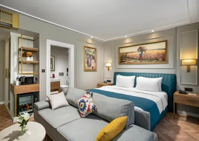 a hotel room with a bed and a couch at Royan Suites in Istanbul
