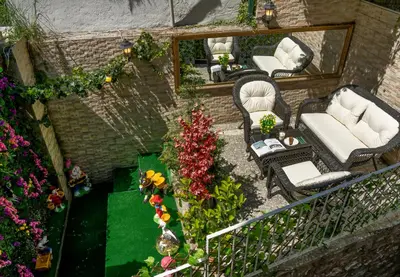 an overhead view of a patio with chairs and flowers at Royan Suites in Istanbul
