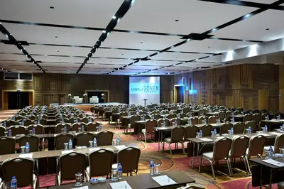 a large room filled with tables and chairs at Istanbul Gonen Hotel in Istanbul