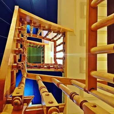 a staircase in a room with a mirror at Belizia Hotel in Istanbul