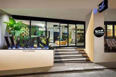 a lobby of a building with plants in the windows at The Westist Hotel & Spa - Special Category in Istanbul