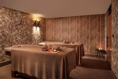 a hotel room with two beds with candles on them at The Westist Hotel & Spa - Special Category in Istanbul
