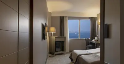 a hotel room with a bed and a window at Taksim Square Hotel in Istanbul
