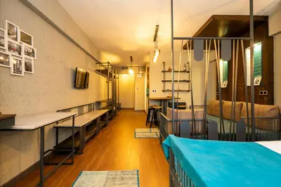 a room with benches and tables in a room at Cube Suites in Istanbul