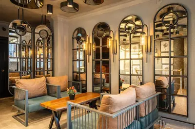 a restaurant with a table and chairs and windows at Cube Suites in Istanbul