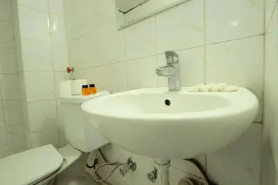 a white bathroom with a sink and a toilet at Istanbul Metro Hotel in Istanbul