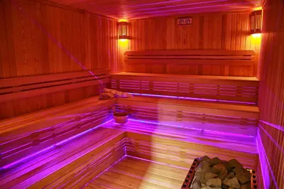 a sauna with purple lights on the inside at Tuzla Garden Hotel & Spa in Tuzla