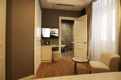a room with a bathroom with a sink and a toilet at Royal Tophane in Istanbul