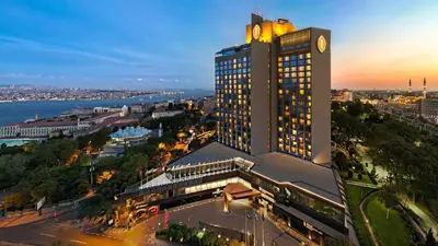 a large building with a clock tower on top of it at InterContinental Istanbul by IHG in Istanbul