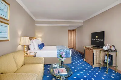 a hotel room with a bed and a couch at InterContinental Istanbul by IHG in Istanbul
