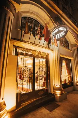 a building with a gate with flags on it at Marmara Deluxe Hotel in Istanbul