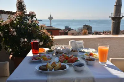 a blue table with plates of food and drinks at Dilhayat Kalfa Hotel in Istanbul
