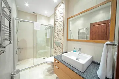 a bathroom with a sink and a shower and a toilet at Dilhayat Kalfa Hotel in Istanbul