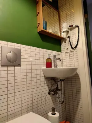 a bathroom with a sink and a toilet at Kunterbunt Istanbul in Istanbul