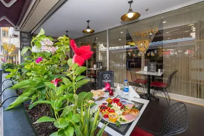 a table with food on it in a restaurant at Regno Hotel in Istanbul