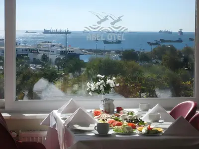 a table with food on it in front of a window at Abel Hotel in Istanbul