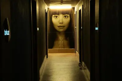 a hallway with a painting of a woman on the wall at Cevahir Hotel Istanbul Asia in Istanbul