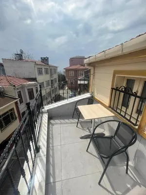 a patio with a table and chairs on a balcony at Ottoman Elegance Hotel in Istanbul