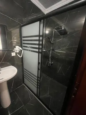 a bathroom with a glass shower with a sink at Ottoman Elegance Hotel in Istanbul