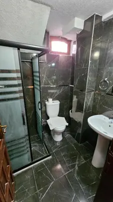 a bathroom with a toilet and a shower and a sink at Ottoman Elegance Hotel in Istanbul