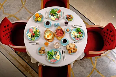 a white table with plates of food on it at KRALICE HOTEL in Istanbul