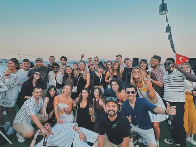 a group of people posing for a picture on a boat at Cheers Midtown Hostel in Istanbul