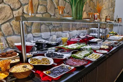 a buffet with a lot of food on a table at Kavala Hotel in Bursa